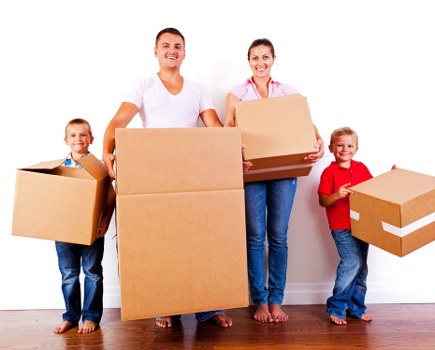Staff using safe lifting techniques during a move