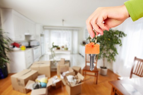 Professional movers handling access in a busy Elephant and Castle street