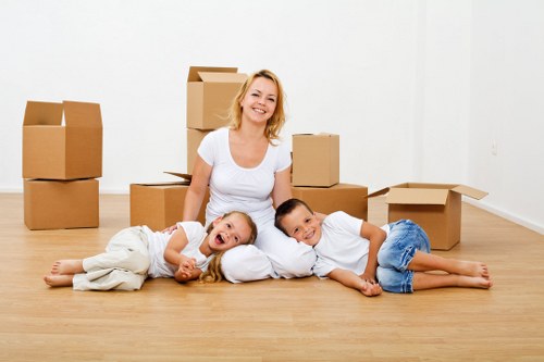 Removal team handling boxes and furniture for a local house move