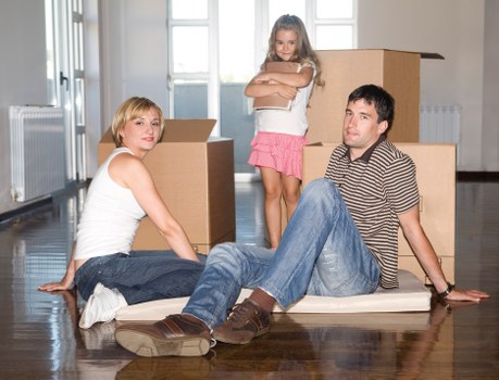 Residents preparing boxes and furniture for a removals van move